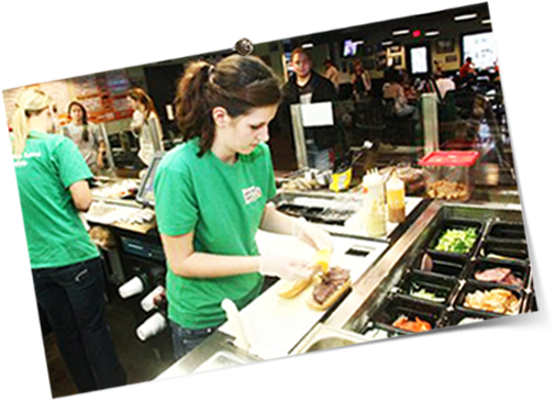 Employees working the sandwich line